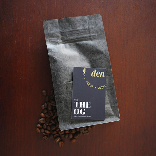 Coffee bag with a label on a wooden surface